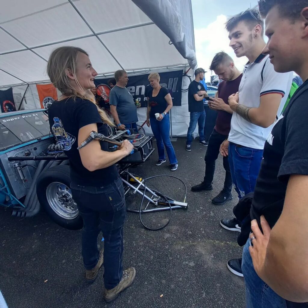 Kirsten van Croonenborgh talking with fans, she's holding a Snap On wrench