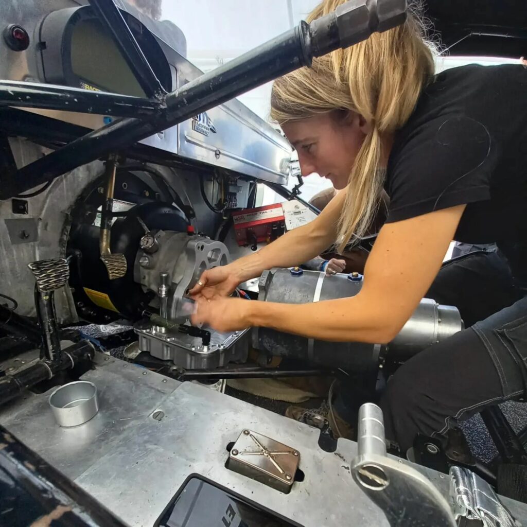 Kirsten van Croonenborgh working on SuzyQ, she's wrenching the Bruno converter drive